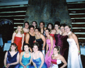 A group of women wearing dresses at an Alpha Gamma Delta event.